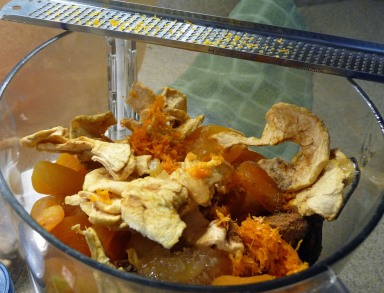 Dried fruit, honey, orange zest & spices in the food processor (c) jfhaugen